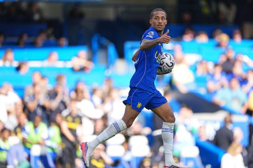 Chelsea's Joao Pedro celebrates after scoring his side's second goal during the English Premier League soccer match between Chelsea and Hull City in London, Saturday, Sept. 12, 2026. (AP Photo/Dave Shopland)